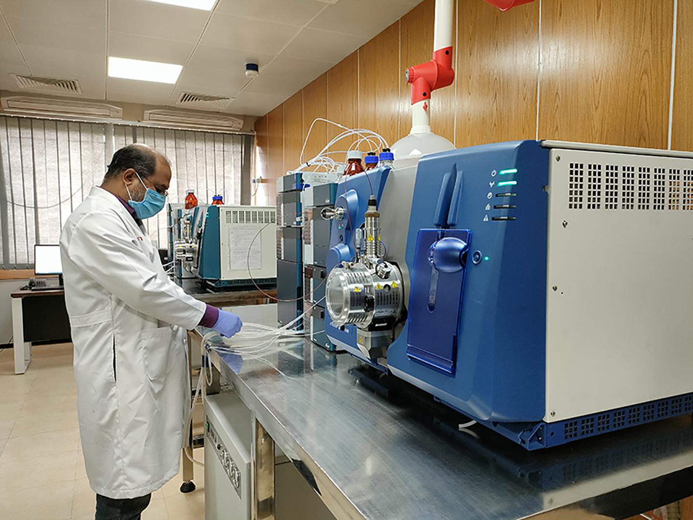 IMAGE PLACEHOLDER — veterinary laboratory technician testing milk residue samples